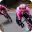 Cyclists aggressively leaning bikes into a tight corner, demonstrating the high clearance angle of the pedals