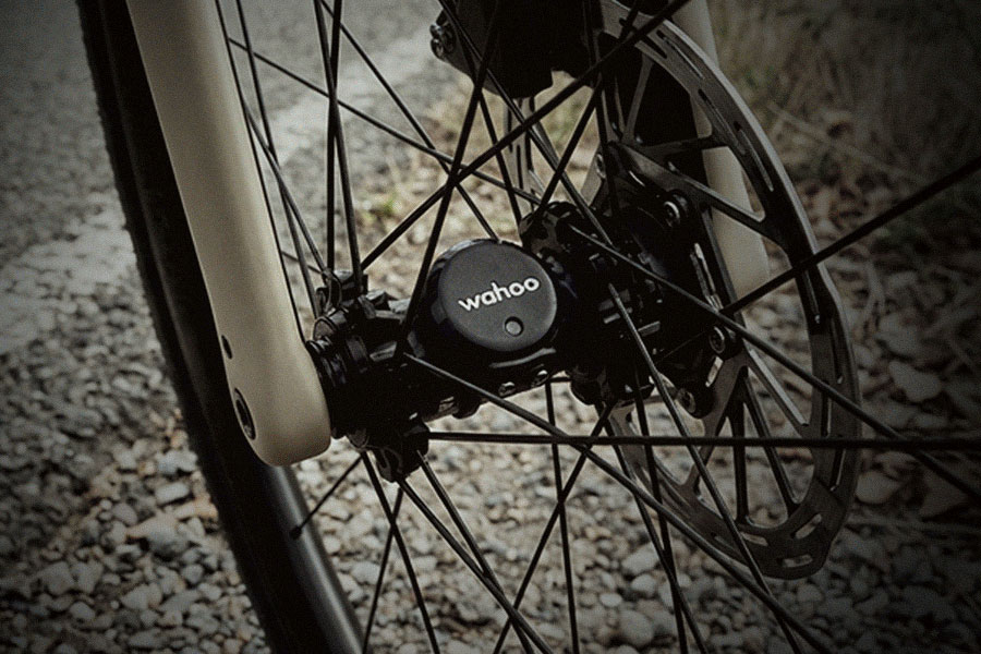 Wahoo speed sensor attached to a bicycle wheel hub